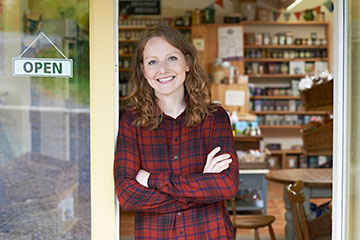 Women standing in front of her store