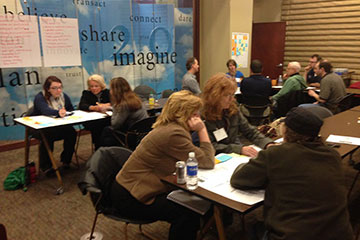 People sitting at tables during a planning session