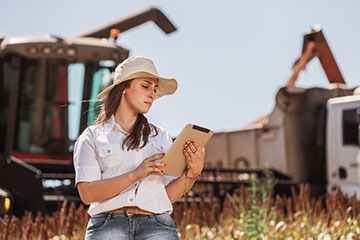 Female farmer using a tablet computer in a field