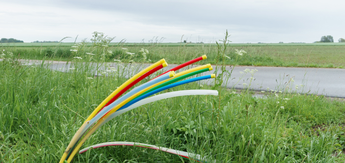 Fiber optic cables near a road in rural Wisconsin.