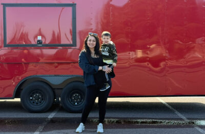 Brittany Gordon stands in front of her Ike’s Place food truck.
