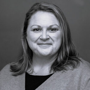 kelly-traczyk-bw-350sq Black & white photo of Kelly Traczyk.